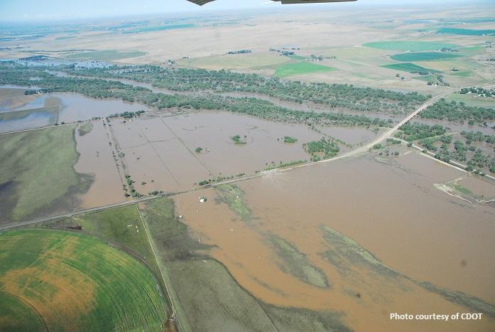 Overhead view of farmland covered in brown water after the 2013 South Platte flood