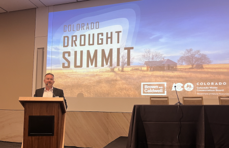 Russ Sands stands at a podium at the drought summit