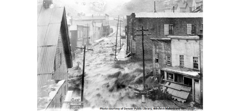 Flood waters form a raging river down the main road in Blackhawk during a flood in 1887